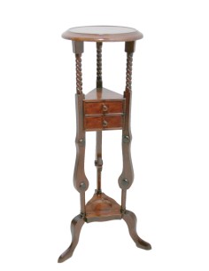 Pedestal de caoba con cajones centrales y forma torneada