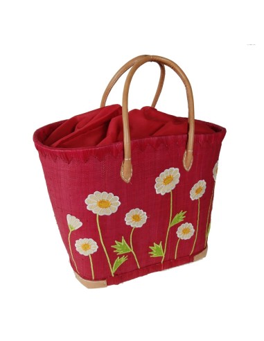 Panier de courses en raphia rouge avec détail floral et poignée en cuir, fermeture intérieure.
