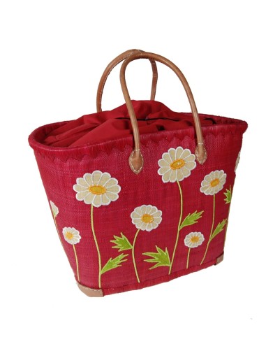 Panier de courses en raphia rouge avec détail floral et poignée en cuir, fermeture intérieure.