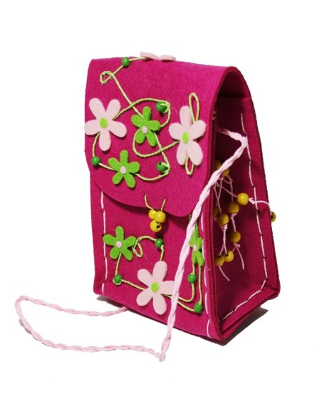 Bossa bandolera infantil de tela amb flors color rosa. Mesures: 9x26x15 cm.