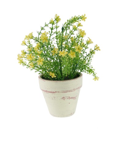 Fleur artificielle dans un pot en céramique avec décor de fleurs jaunes.