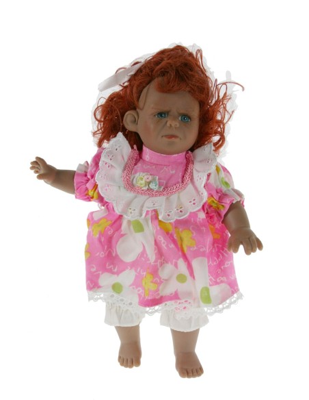 Muñeca con carácter y vestido de color rosa y cabello pelirrojo. Medidas: 25x20x12 cm.